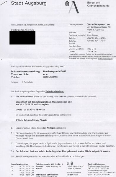 Datei:Auflagen Infostand Augsburg0.jpg